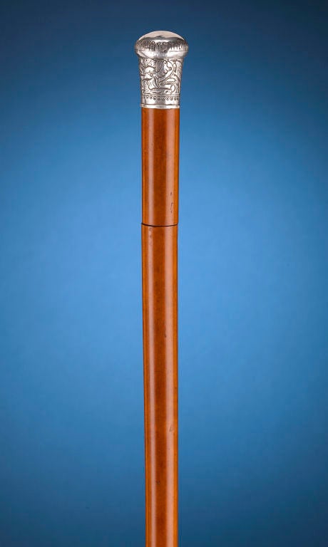 A gentle tug on the silver knob handle of this antique walking stick reveals a lethal sword. Concealed inside its sturdy Malacca shaft is a rare, estoc-style sword blade. Derived from the centuries old, French thrusting sword, this three-sided blade