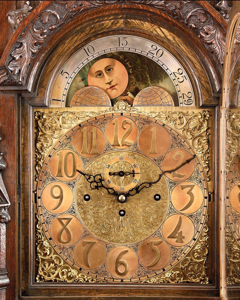 This magnificent longcase, or grandfather, clock is a work of exceptional skill and artistry. Standing over 8 feet tall, this monumental timepiece is comprised of a substantial three-train movement run by three gilded weights and a mercury pendulum
