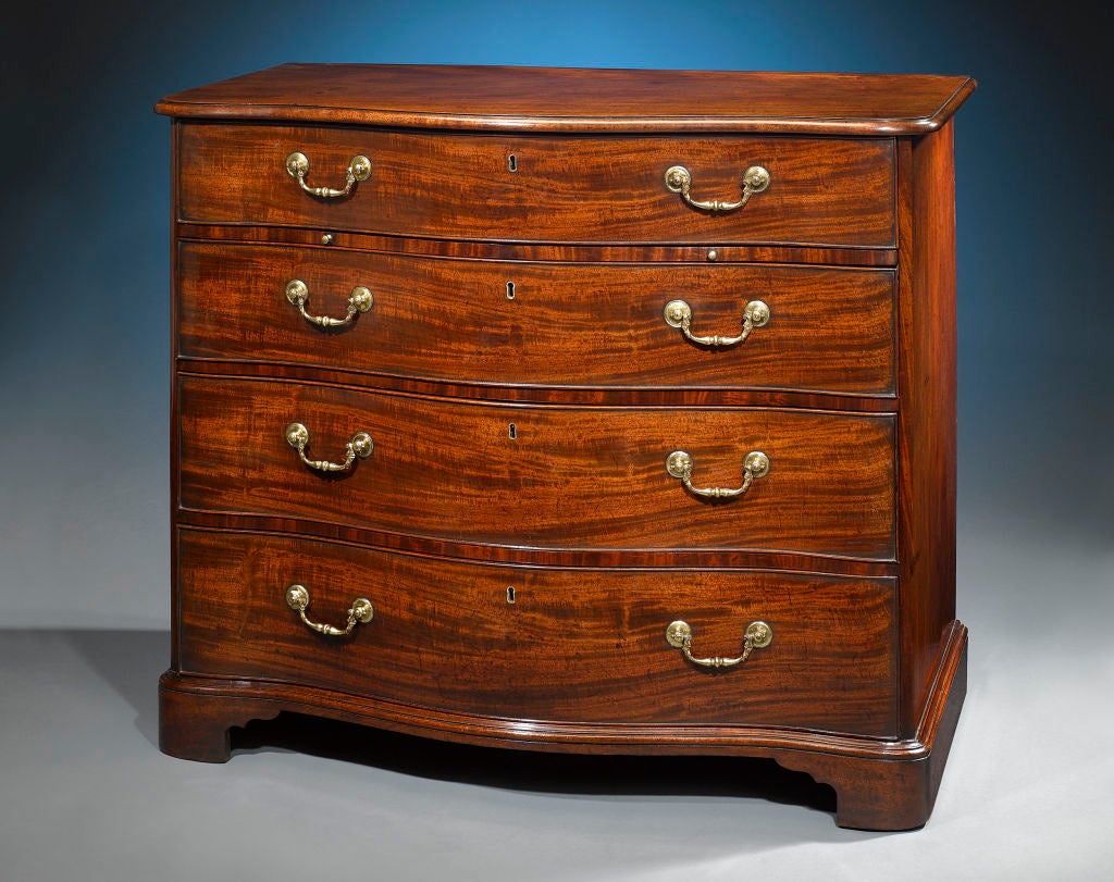This incredibly rare serpentine-front antique chest of drawers was almost certainly crafted by the iconic Thomas Chippendale, and is counted as one of the few examples in existence made by his hand. A magnificent mahogany masterpiece, the dresser is