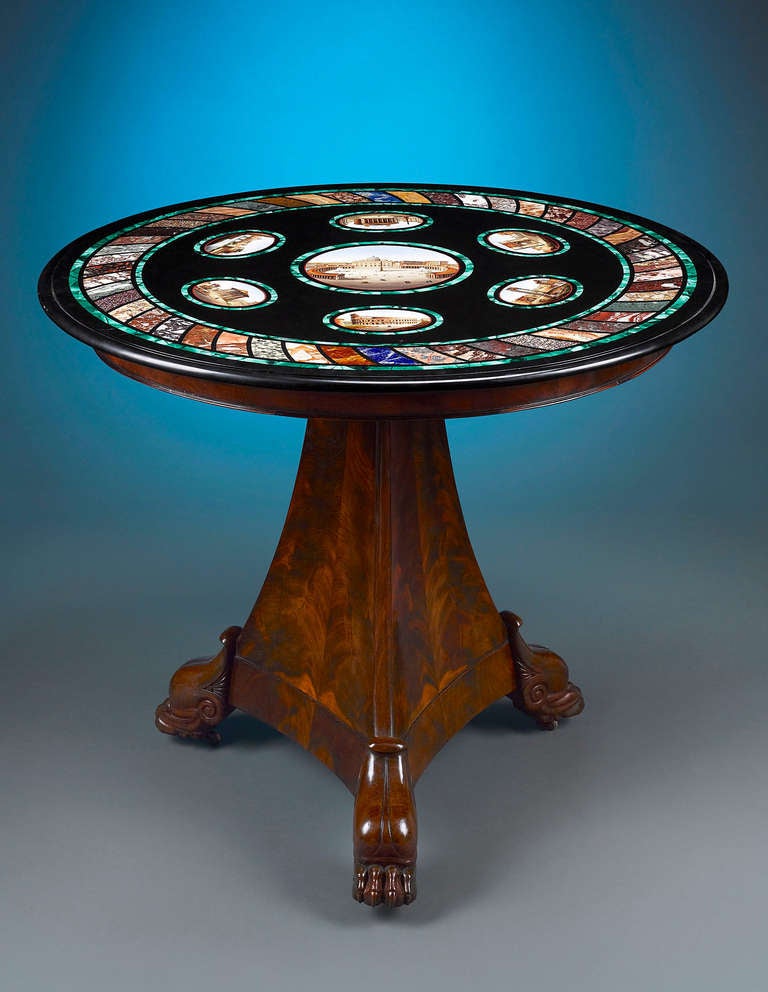 This rare and intriguing antique table boasts an intricately crafted micromosaic top. Seven individual scenes of ruins and monuments adorn the ebonized surface, including the magnificent view of St. Peterâ??s Square, with its iconic basilica,