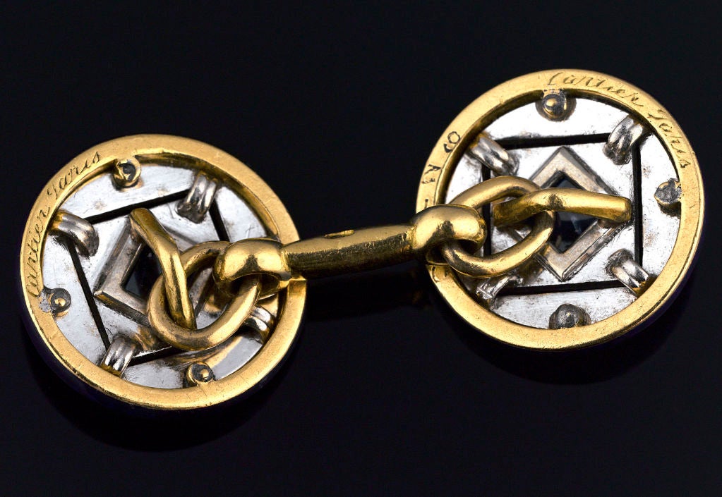 These elegant Art Deco cufflinks from the famed jewelry house of Cartier are the pinnacle of taste. Crafted in a sleek geometrical motif, these links boast cabochons of deep blue sapphire, weighing approximately .75 total carats, surrounded by 2.00