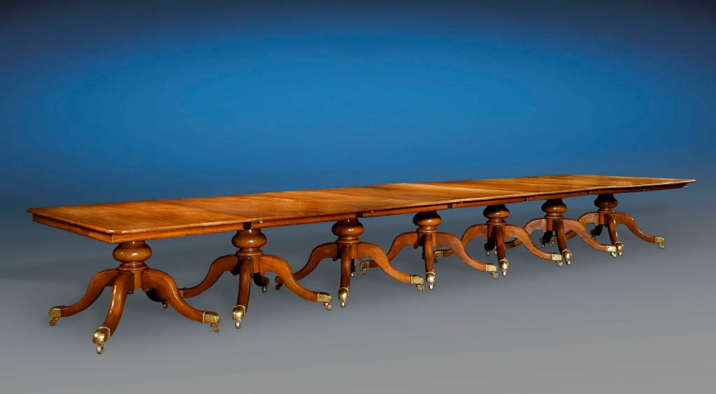 Measuring over 30 feet in length, this tremendous and highly versatile English dining table is the greatest. It has the ability to transform to a multitude of sizes to fit any occasion, providing comfortable seating for 32 people when fully