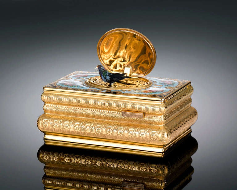 This stunning Swiss singing bird box combines exquisite artistry with outstanding mechanical craftsmanship. Not only beautiful to behold, this enchanting silver-gilt and enamel, Rococo-style creation holds a fine feathered bird automaton that, with