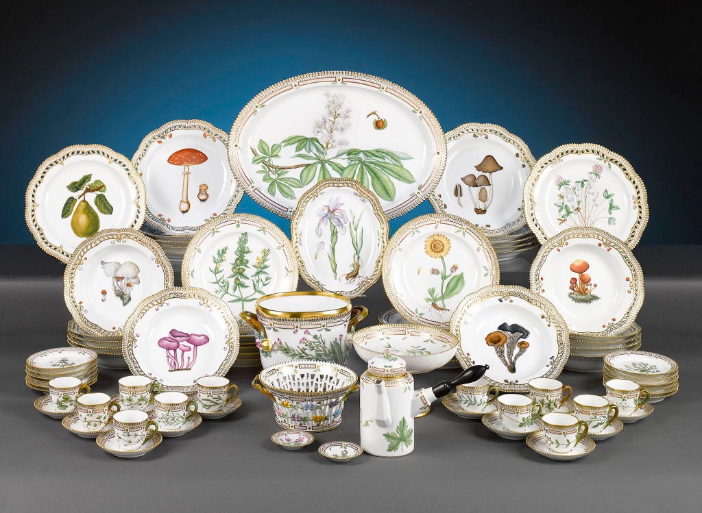 This spectacular, 80-piece Royal Copenhagen porcelain service exhibits the world-renowned Flora Danica pattern. This remarkable set not only displays the incredible variety of plant life depicted in the Flora Danica motif over the centuries, but