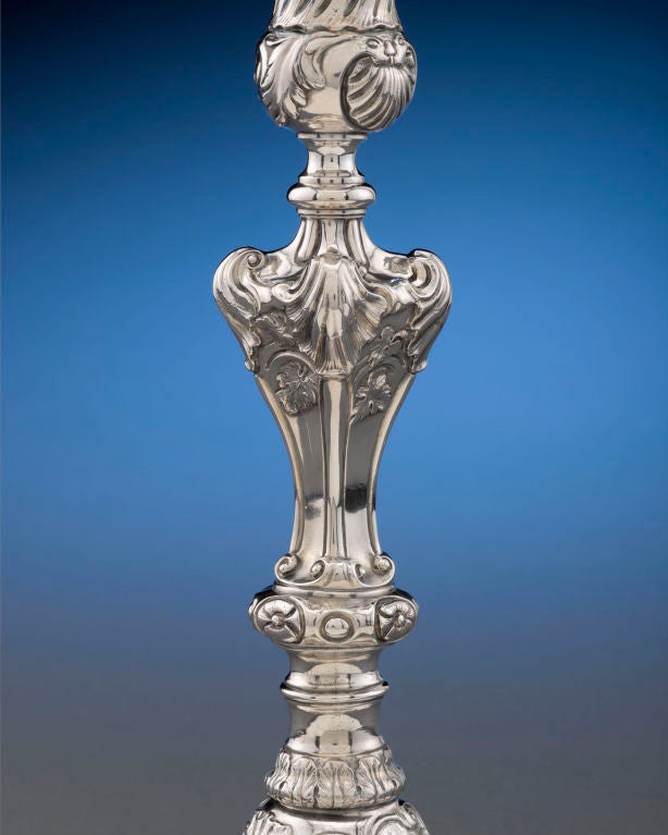 These spectacular George II-era silver candlesticks by celebrated silversmith Paul de Lamerie were made for a member of the Duncombe family and feature finely crafted Rococo designs. Adorned with a lavish shell motif, accented by rocaille flourishes