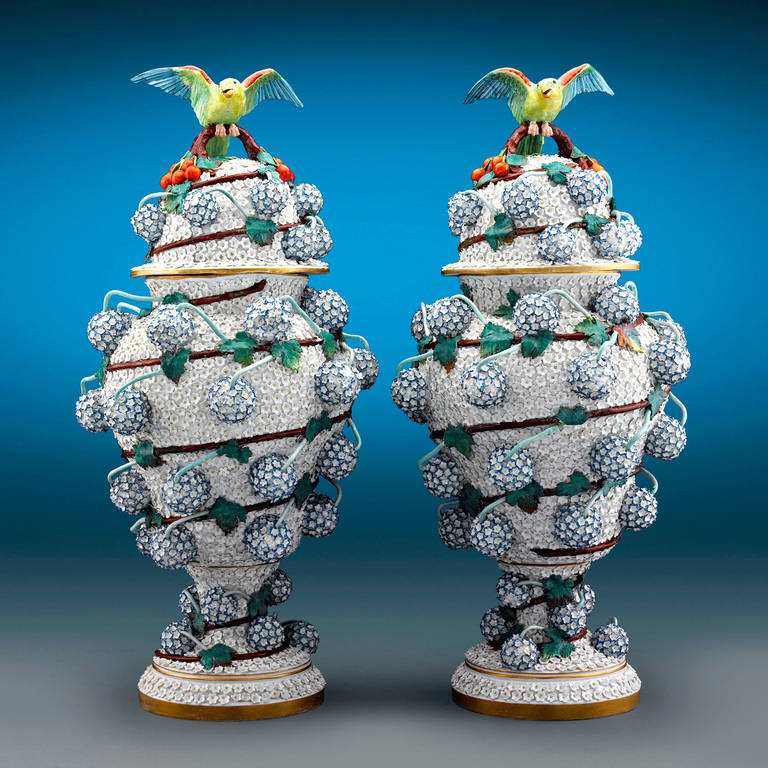 This rare and monumental pair of antique Meissen porcelain covered vases is crafted in the illustrious <em>Schneeballen,</em> or Snowball, pattern. First modeled by the famed Johann Joachim Kændler in 1739, these extraordinary vases are covered with