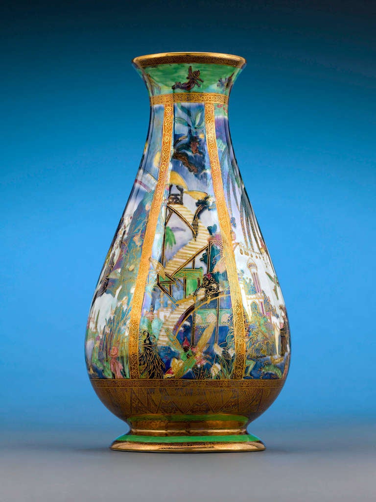 One of the earliest Fairyland Lustre motifs, this Pillar pattern vase by Wedgwood features the fantastical Isle of the Genii, populated with nymphs and elves at every turn. Introduced by Wedgwood artist Daisy Makeig-Jones in 1915, Fairyland Lustre