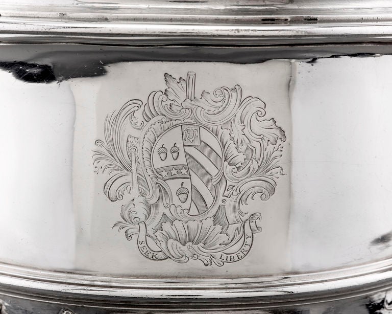 Grapevines of incredible realism and exquisite detail turn this silver cup and cover by Francis Nelme into an organic masterpiece. As the vines form the handles in a fully decorated twisting of branches, grapes and leaves, they also entwine the