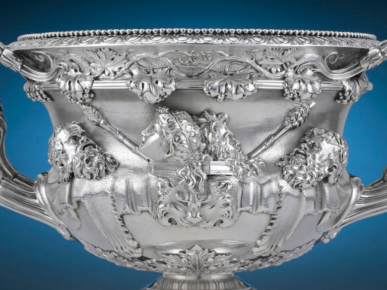 This monumental antique silver wine cooler by the renowned silversmith Paul Storr is crafted in the form of the iconic and much-lauded Warwick Vase. One of the most famous designs in classical silver, this urn exhibits exceptional castings and