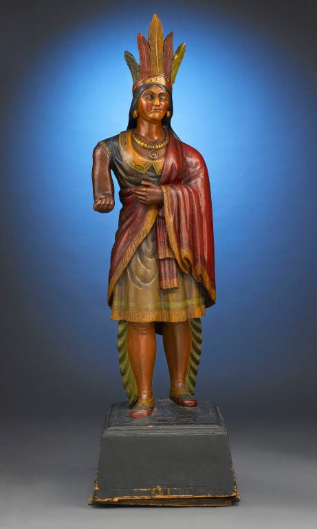 This magnificent and extremely rare cigar store Indian princess, attributed to the renowned artist Samuel A. Robb, is expertly carved and finely decorated, and is a wonderfully preserved example of the time-honored art of American wood carving. This