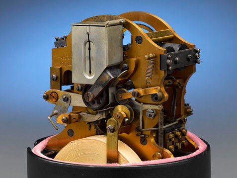 This amazing stock ticker telegraph, designed and manufactured by legendary inventor Thomas Alva Edison, is the symbol of Wall Street. Held atop a cast-iron base beneath its original glass dome, this ingenious mechanism, known as a Universal Stock