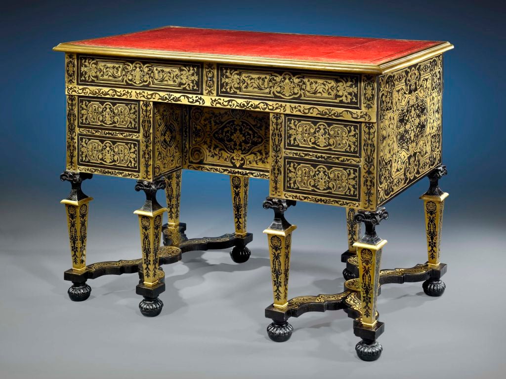 This wonderful French desk is decorated in the exquisite tortoiseshell-and-bronze inlay style perfected by celebrated ébéniste André-Charles Boulle. Displaying some of the finest craftsmanship of the 19th century, this desk is a testament to