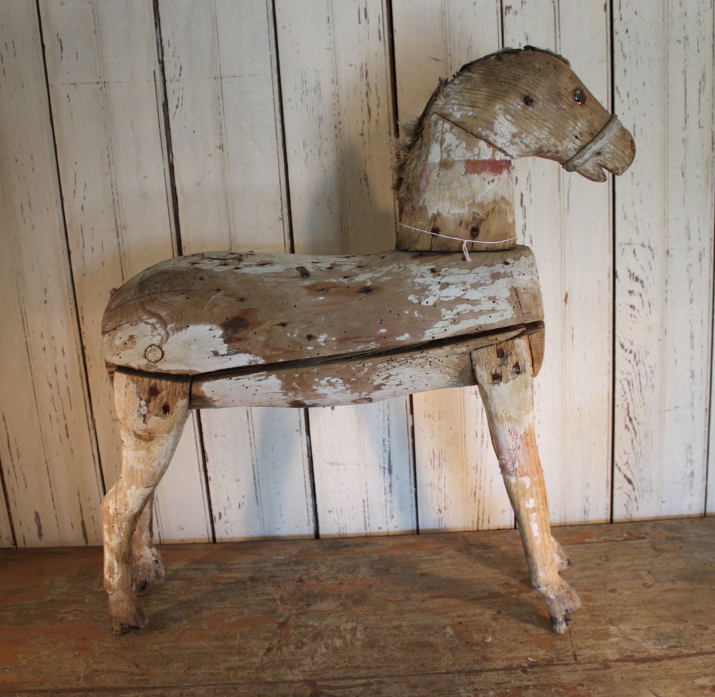 Sweet wooden horse with charming patina.