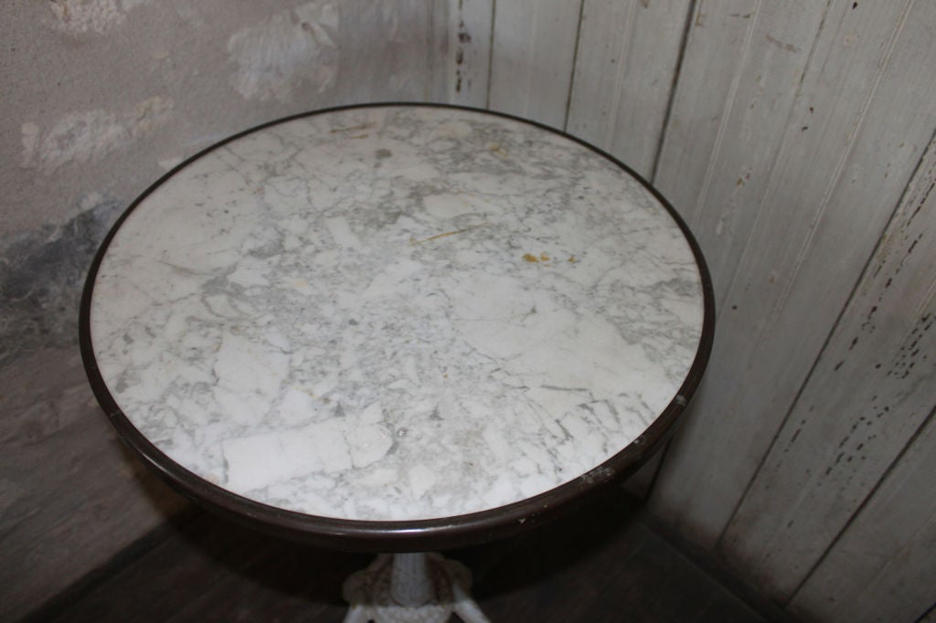 Unique bistro table with marble top.