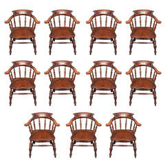 A rare set of eleven Victorian Ash and Elm bow back elbow chairs.