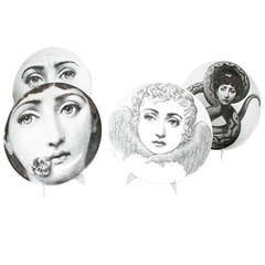 A Set of six porcelain plates by Piero Fornasetti A Set of six porcelain plates by Piero Fornasetti