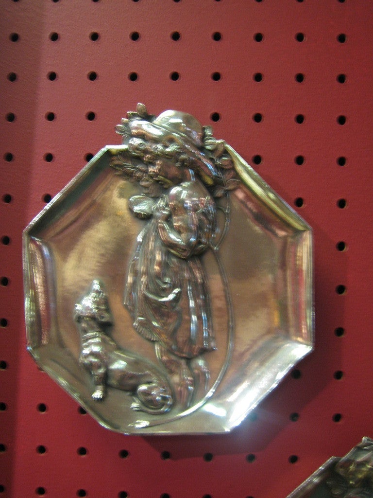 Wonderful pair of Art Nouveau silver plate on Brittania metal wall plaques - the first depicts a little girl with a dog and the second is of a little girl with a goose taking flowers out go her basket. These are of very good quality, probably either