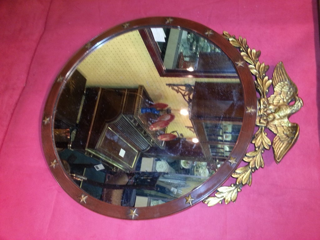Handsome American 19th cent mahogany and gilt circular mirror with gilt Eagle on top.