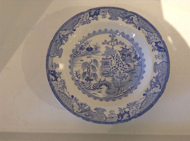 Lovely set of 8 blue/ white Willow pattern Transferware  Ironstone china rimmed soup bowls by Ashworth's, England. The bowls have the Ashworth's. Impressed mark to the underneath as well as a crown mark with patent Ironstone China.