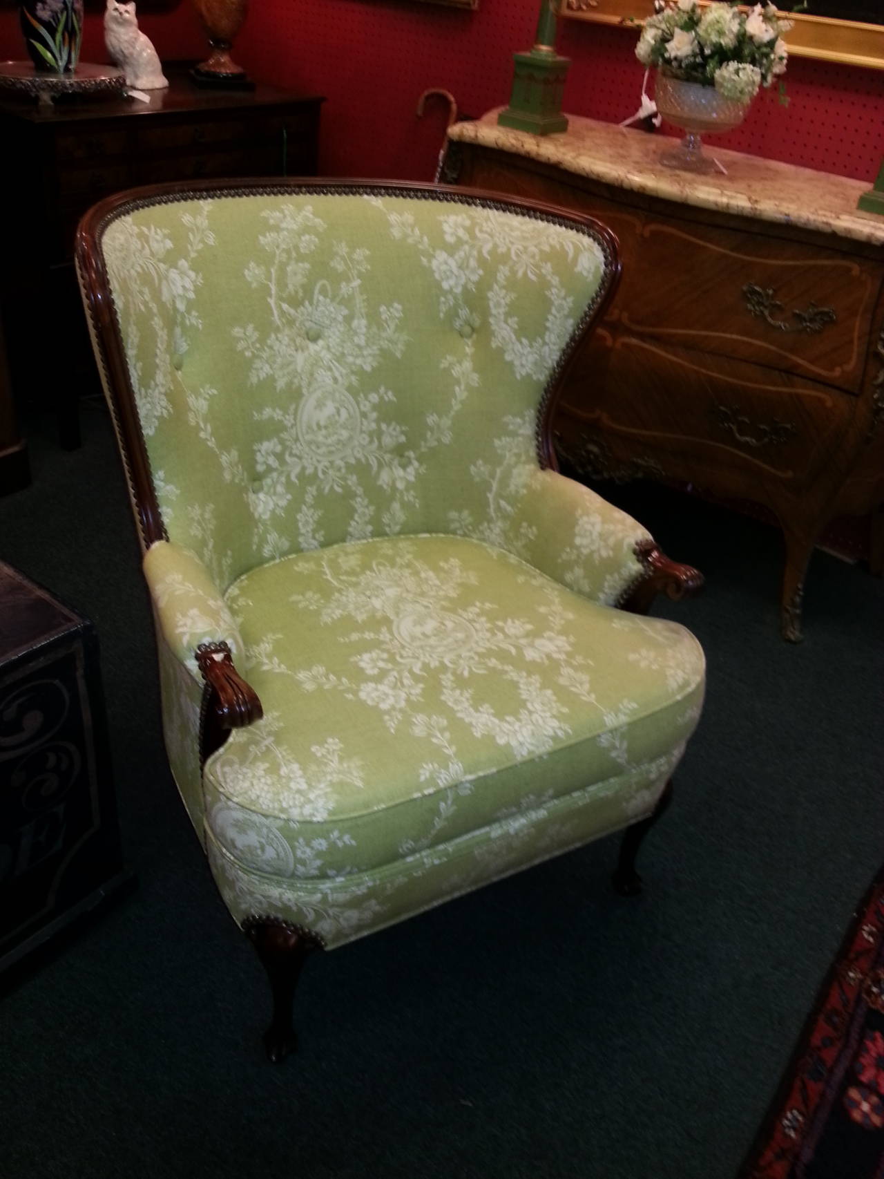 Wonderful wingback chair newly upholstered in lime green toile with nailhead trim throughout. Chair frame is mahogany.