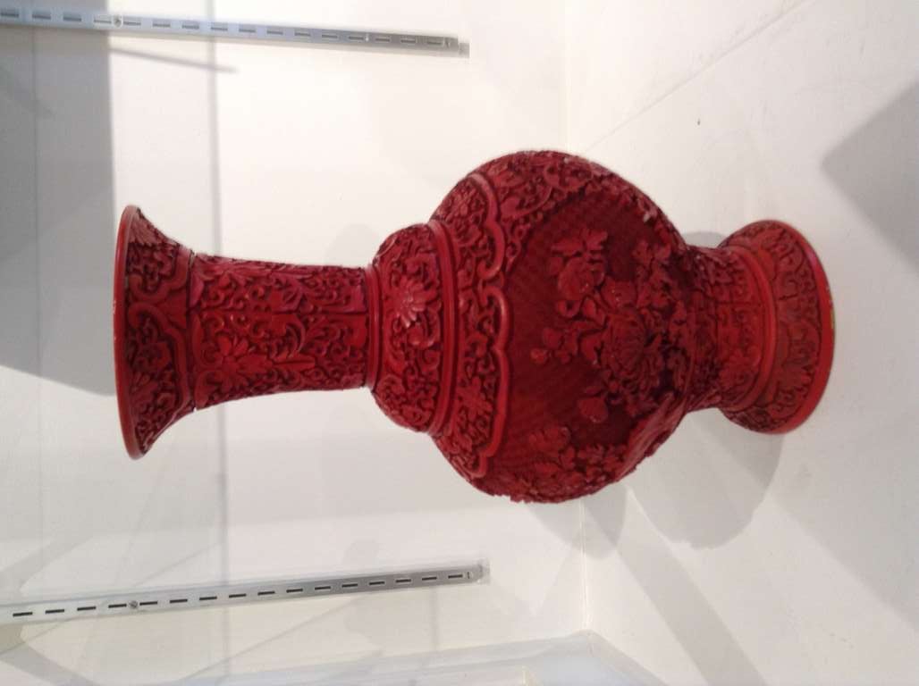 CHINESE RED LACQUER CINNABAR VASE. SOME MINOR IMPERFECTIONS WHICH DO NOT DETER FROM THE BEAUTY OF THIS VASE. GREAT FORM
