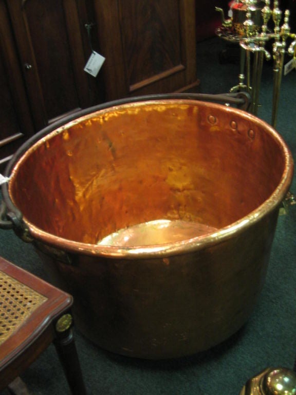 WONDERFUL HUGE COPPER APPLE BUTTER KETTLE WITH WROUGHT IRON HANDLE AND FABULOUS OLD DOVE-TAILS JOINING THE BASE AND SIDE. GREAT FOR LOG STORAGE BESIDE A FIREPLACE!