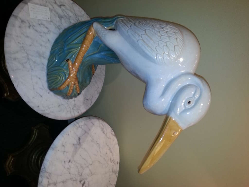 WONDERFUL LIFE SIZE CERAMIC EGRET IN THE MAJOLICA STYLE , PROBABLY FRENCH. THE EGRET IS FABULOUS AND WOULD MAKE A WONDERFUL STATEMENT ON A FRENCH MARBLE TOP CONSOLE!