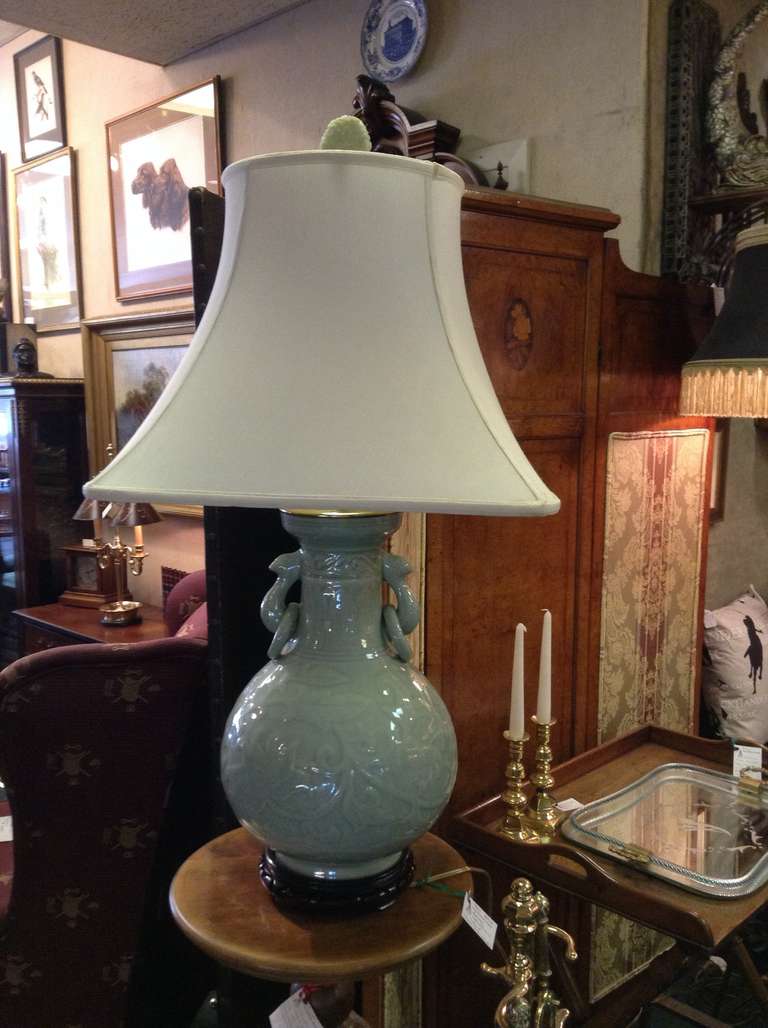Asian celadon table lamp with faux Jade finial.  Height measurements are to top of finial. Height to top of lamp base is 16 inches.