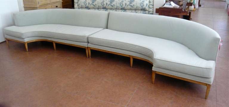 A very stylish mid-century modern sofa with curved ends in two parts.   Incredible length!  Please note:  we have shown the same sofa as separate parts in a separate listing here on 1st dibs.