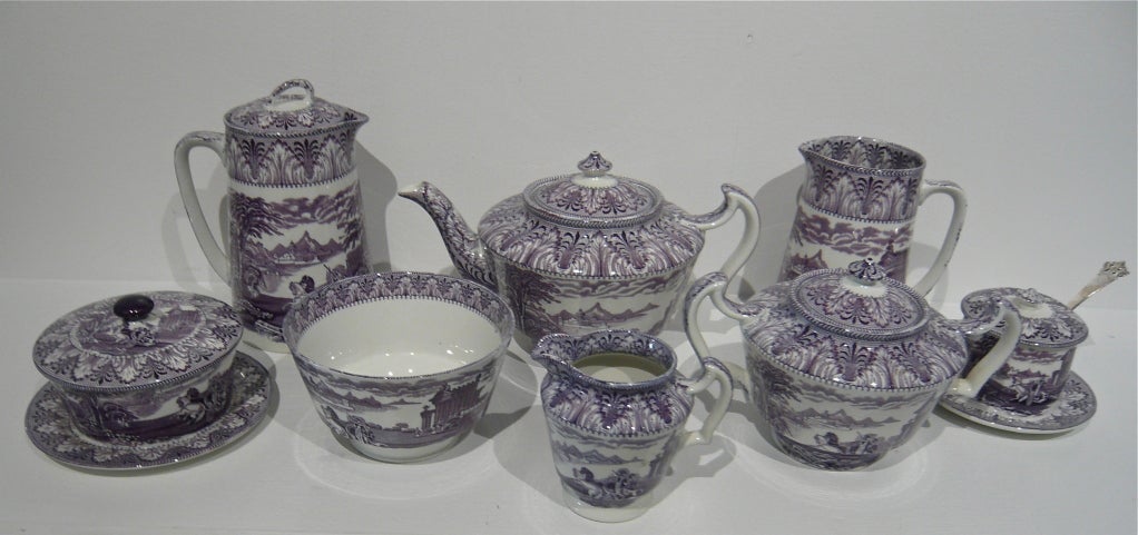 A spectacular English tea service in the Chariot Pattern by Cauldon in a beautiful mauve colorway.  (The photos do not do justice to the color.  It truly is spectacular.)  <br />
<br />
The set consists of an amazing 10 service pieces, including: 