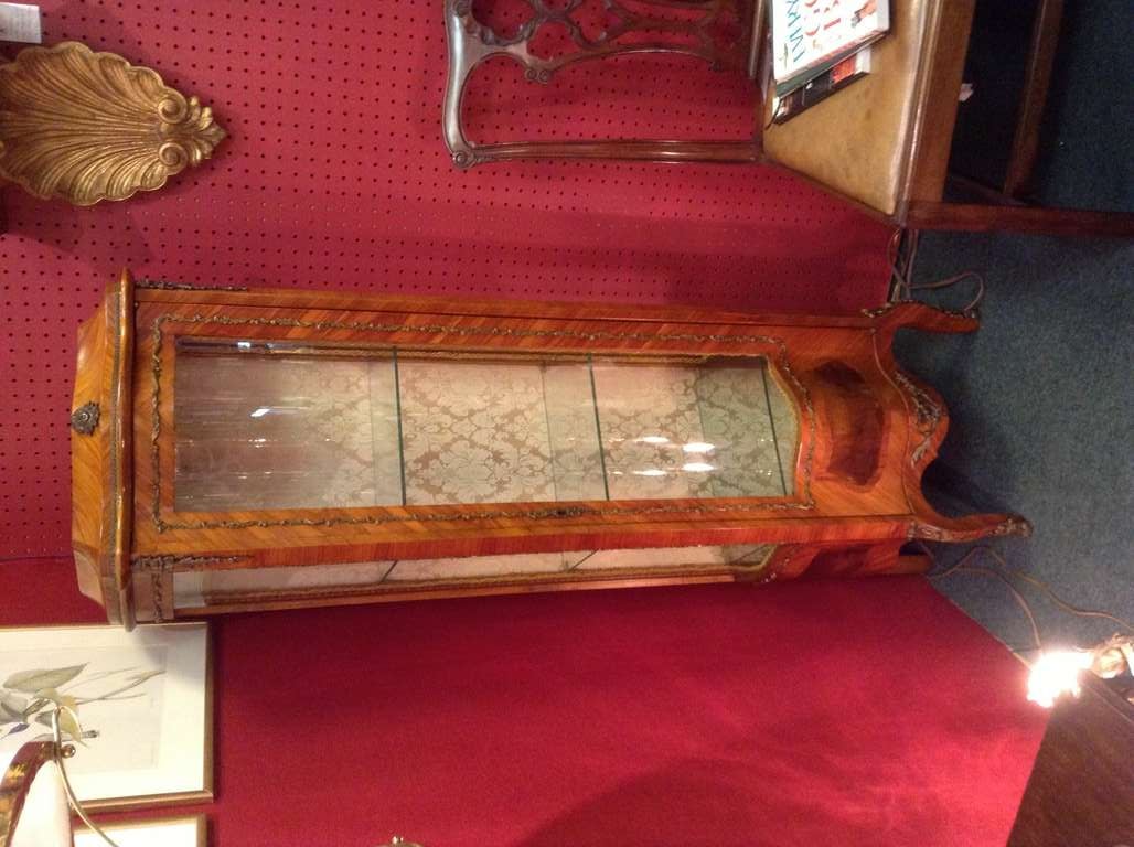 Small Italian early 20th century Bow front Display Cabinet with gilt mounts.
The interior of the cabinet is covered in the original fabric and has three glass shelves. It comes with the original key.
Please contact the dealer 703 599 6018 for more