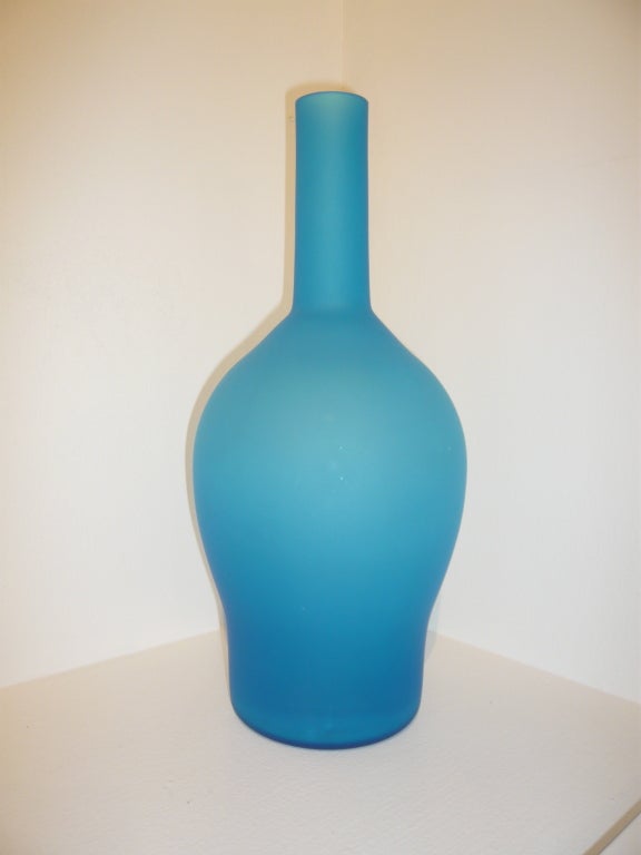 A Blue Satinato hand-blown Venetian glass vase with beautiful, deep saturated color by the renowned Carlo Moretti company.  Very decorative. A sophisticated splash of color in a room, as part of a group or collection, or simply as a vase for a