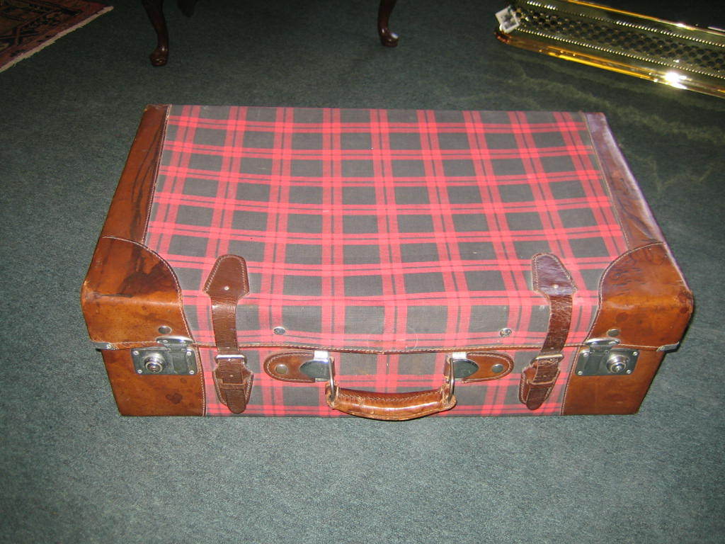 GREAT TARTAN LEATHER BOUND SUITCASE FROM THE 1920'S.  IF YOU WOULD LIKE TO DISPLAY THIS ON A STAND I COULD HAVE ONE MADE EASILY FOR THE PURCHASER. FABRIC MAKER'S LABEL INSIDE - WAS  MADE IN CHINA. THIS HAS BEEN BEAUTIFULLY MADE AND LINED WITH BLUE
