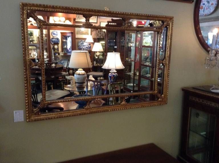 Rectangular Gilt Framed Mirror that can be hung either way horizontally or vertically. The mirror is simple in design but very elegant at the same time. The gilding is in good shape with a very small amount if red showing through which is very