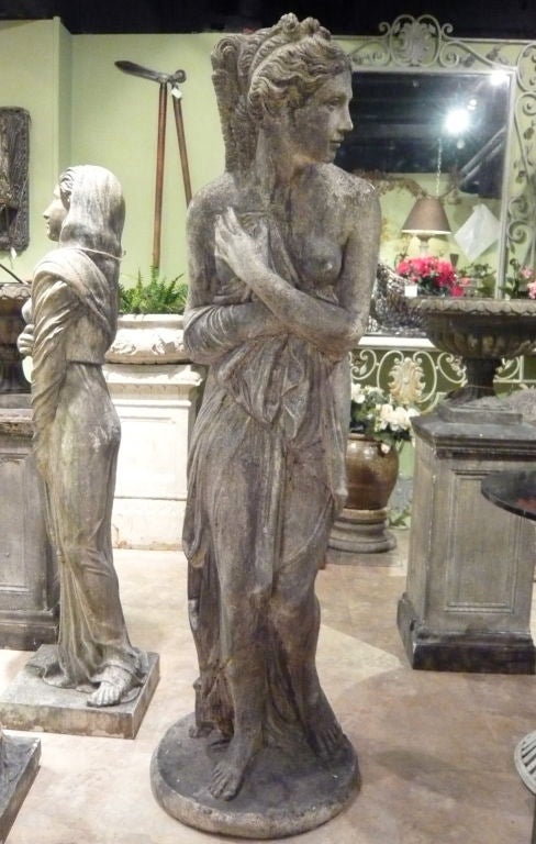 ENGLISH HAND-CARVED SANDSTONE STATUE OF A SCANTILY CLAD MAIDEN.  EXCELLENT DETAIL.  VERY IMPRESSIVE AND WILL ADD GREAT PRESENCE TO A FORMAL GARDEN!
