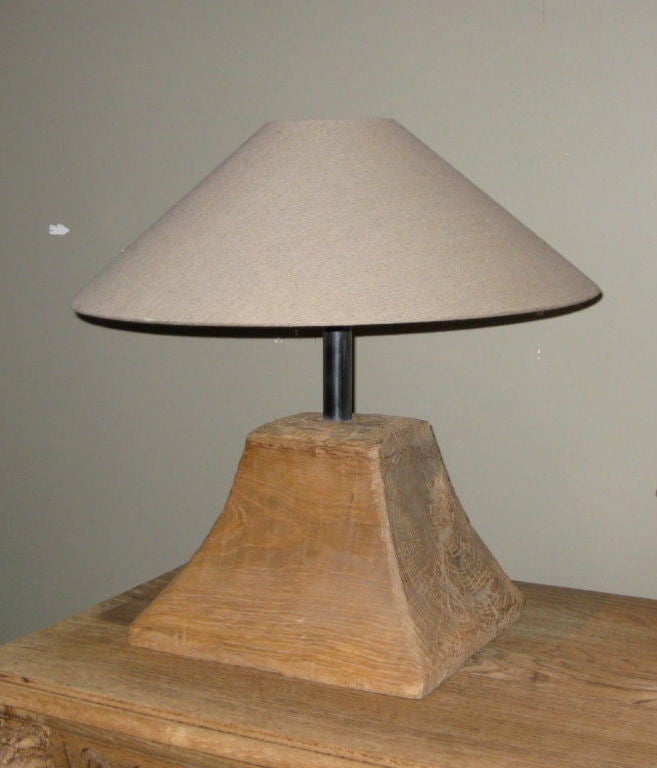 This lamp is made from driftwood that comes from a river in Indonesia.<br />
The shade is linen. The base measures 12x10. The shades is 19 diam.