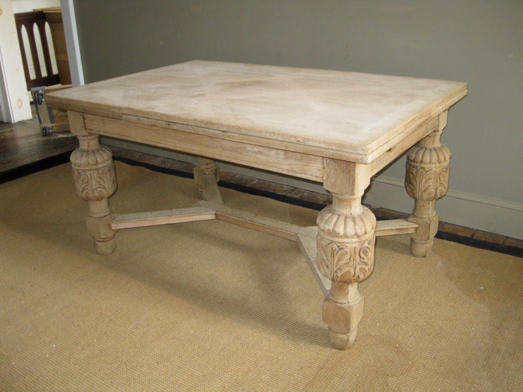 This dining table has carved finial legs and a parquet top.  The table expands to 98