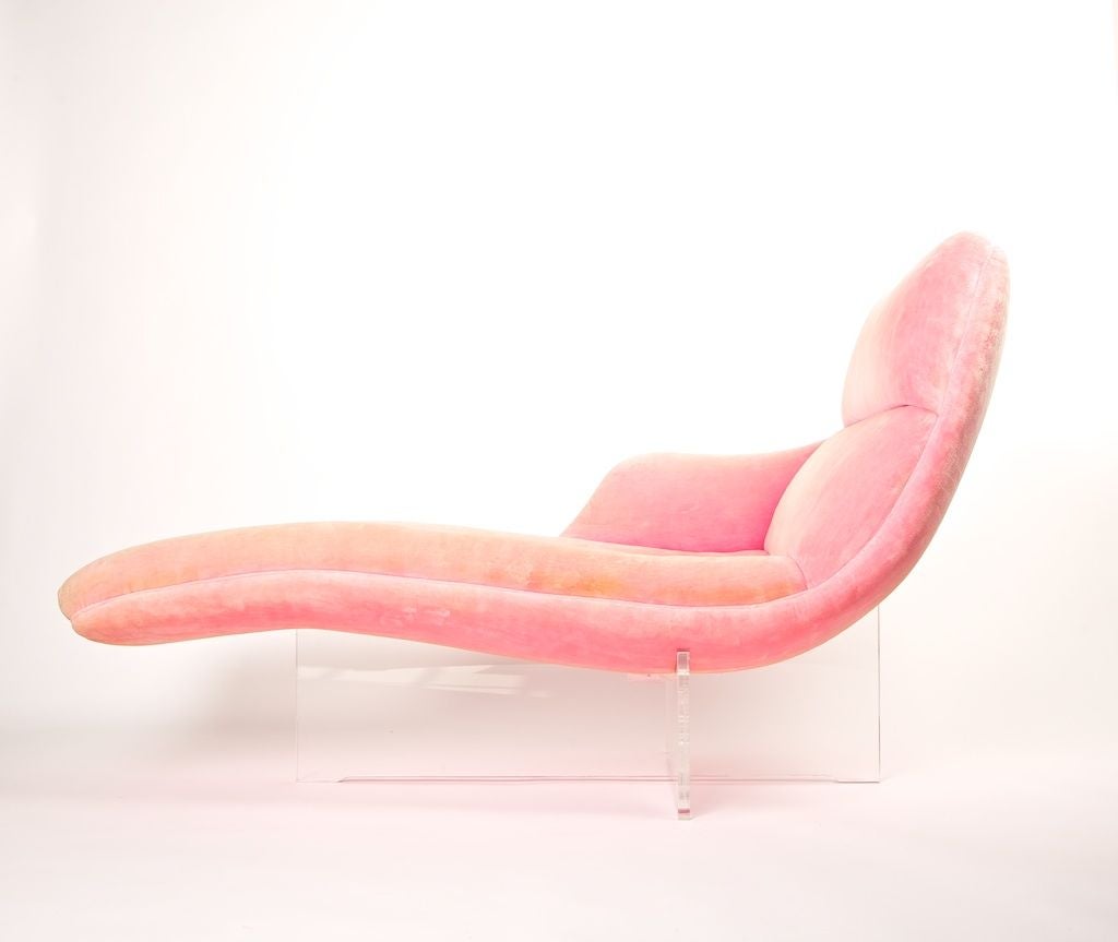 Inspired by the designer's wife, Erica Wilson, this chaise is a blend of elegance and simplicity ideal for the collector of unique furniture design. On a Plexiglas base with pink crushed velvet fabric. <br />
<br />
*Please inquirer for production