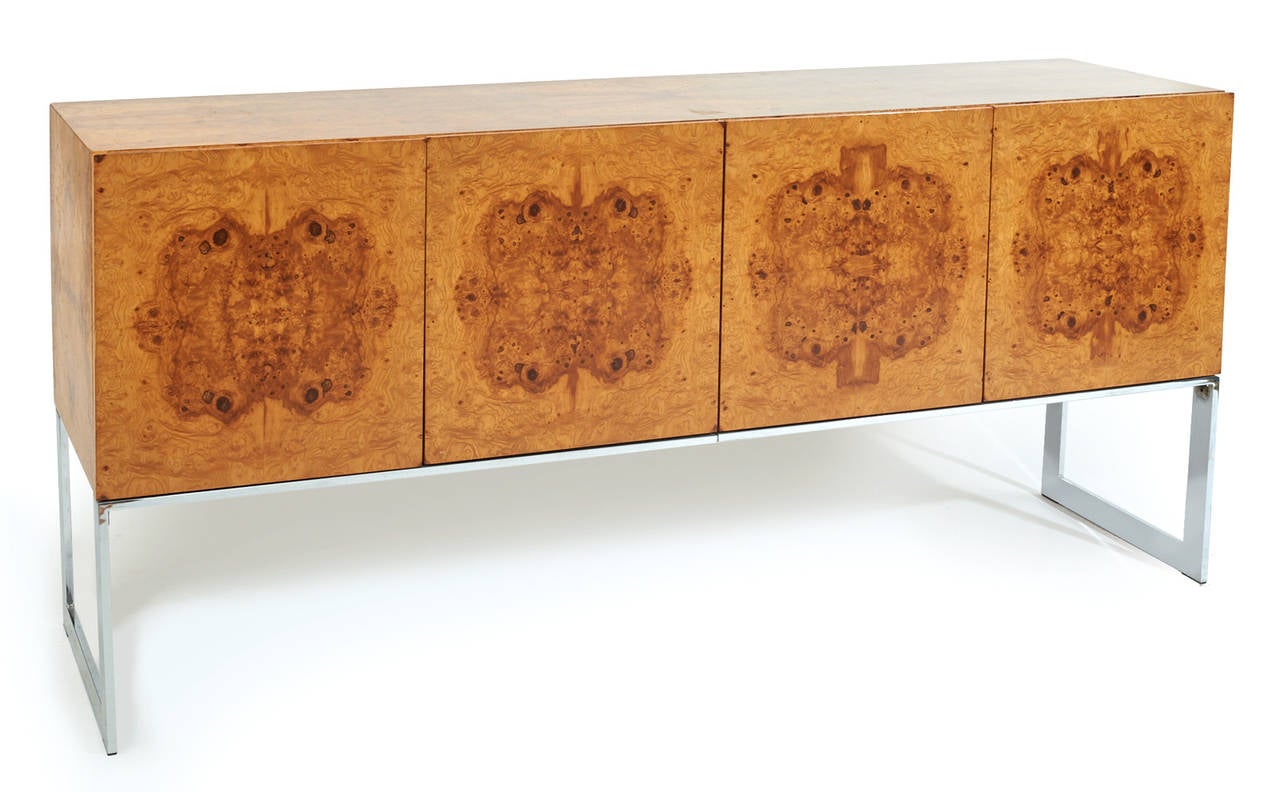 This is a striking early 1970s burl wood and chrome credenza or buffet designed by Milo Baughman for Thayer Coggin. The design incorporates a beautiful burl wood on this four door front case on 