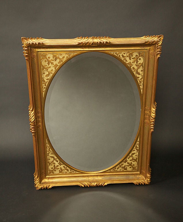 Gold-leaf edge mirror circa early 1960's with fine line detail and etching, handcrafted, mirror has 1-inch bevel, channeled frame and is in terrific condition. A great example of craftsmanship and glamour for your home. Stamped and dated on the back