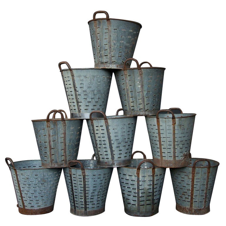 These metal olive picking buckets, with great patina and character, can be used for many different purposes. Examples: storage bins, display in a store front, at home for wastebaskets, umbrella stand, as a great decorative item holding other
