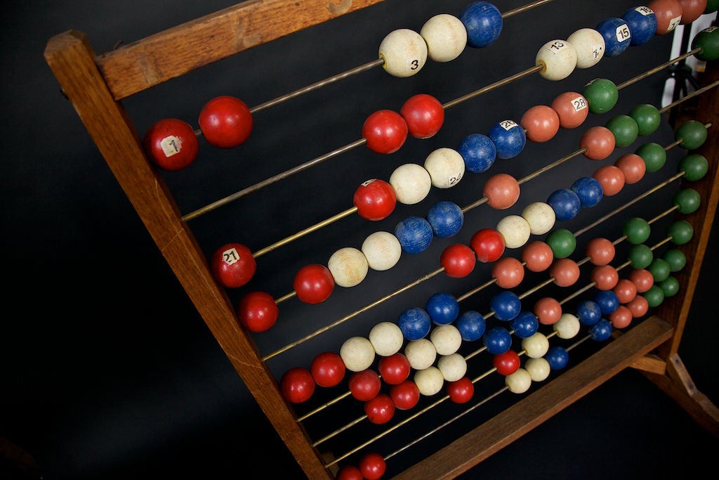 This unique wooden upright abacus can be either a conversation starter, used as a store display or it can actually used for teaching purposes. The wooden balls still retain a beautiful vibrant color and associated patina. The origins are Danish and