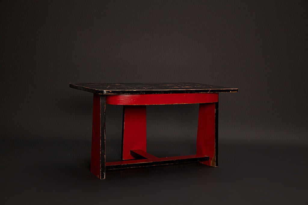 Amazing, nicely worn, red and black painted plywood side or coffee table with Classic 1940s American modernism lines, design and character. Great addition in any modernist home.