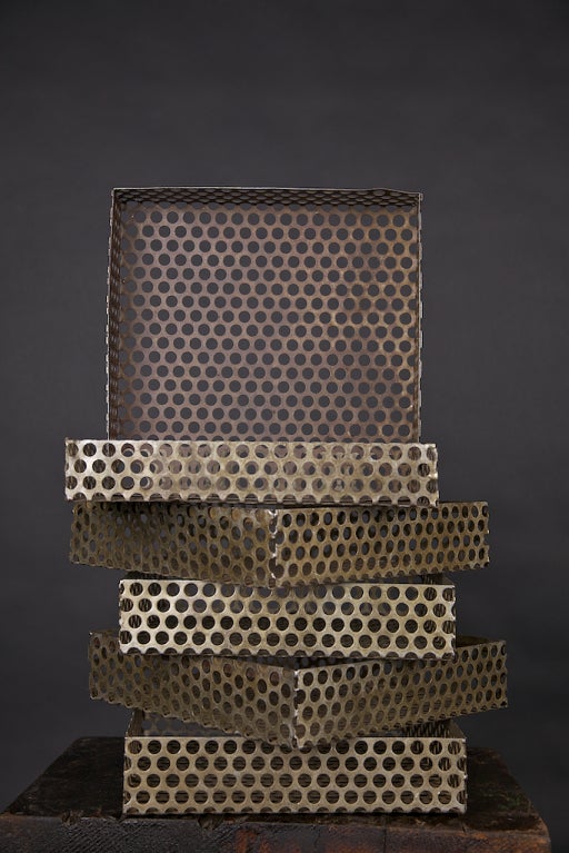 Set of six perforated industrial metal boxes from the 1950's era, great for display in a stack, or separate for form plus function. Naturally aged finish, modeled from machine-cut metal. Visual interest plus usefulness equals pizzazz!