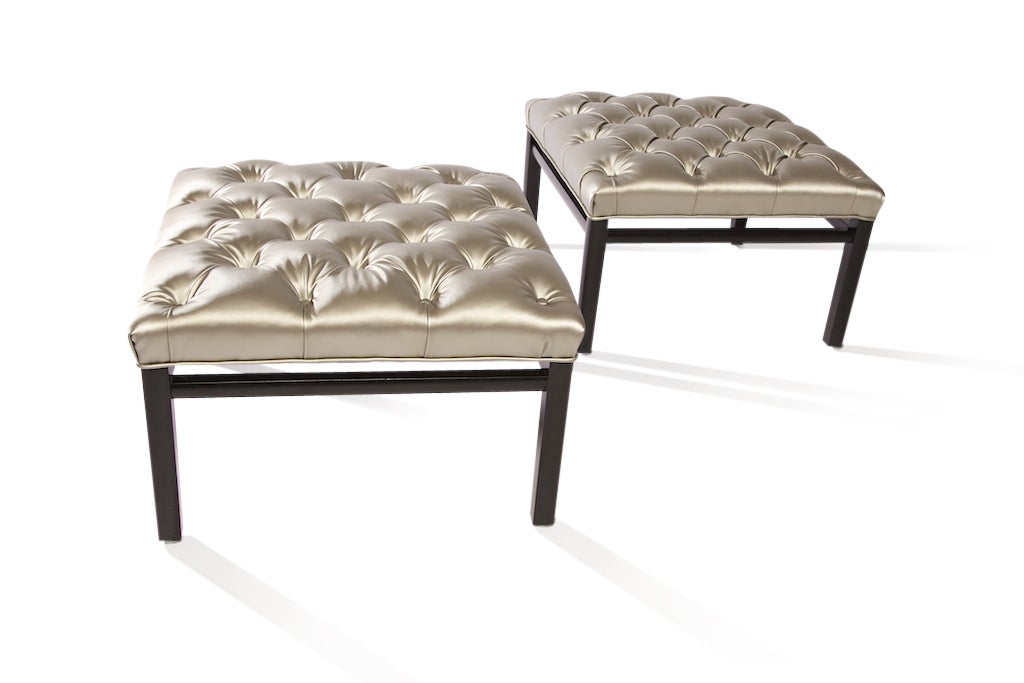 Designed in the style of Harvey Probber, these square stools have a light silver, shimmering, poly-blend fabric, in a tufted, thickly-padded cushioned top in perfect condition. Note the finishing touches, including the structure and the end caps to
