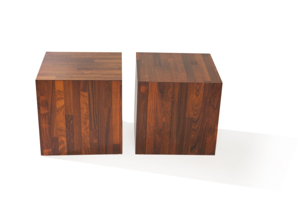 These two rosewood tables, in the definitive Milo Baughman style, are sleek, visually interesting and can be used in a number of different settings and decors. Use them close together with a larger glass topper, as a coffee table, or separately as