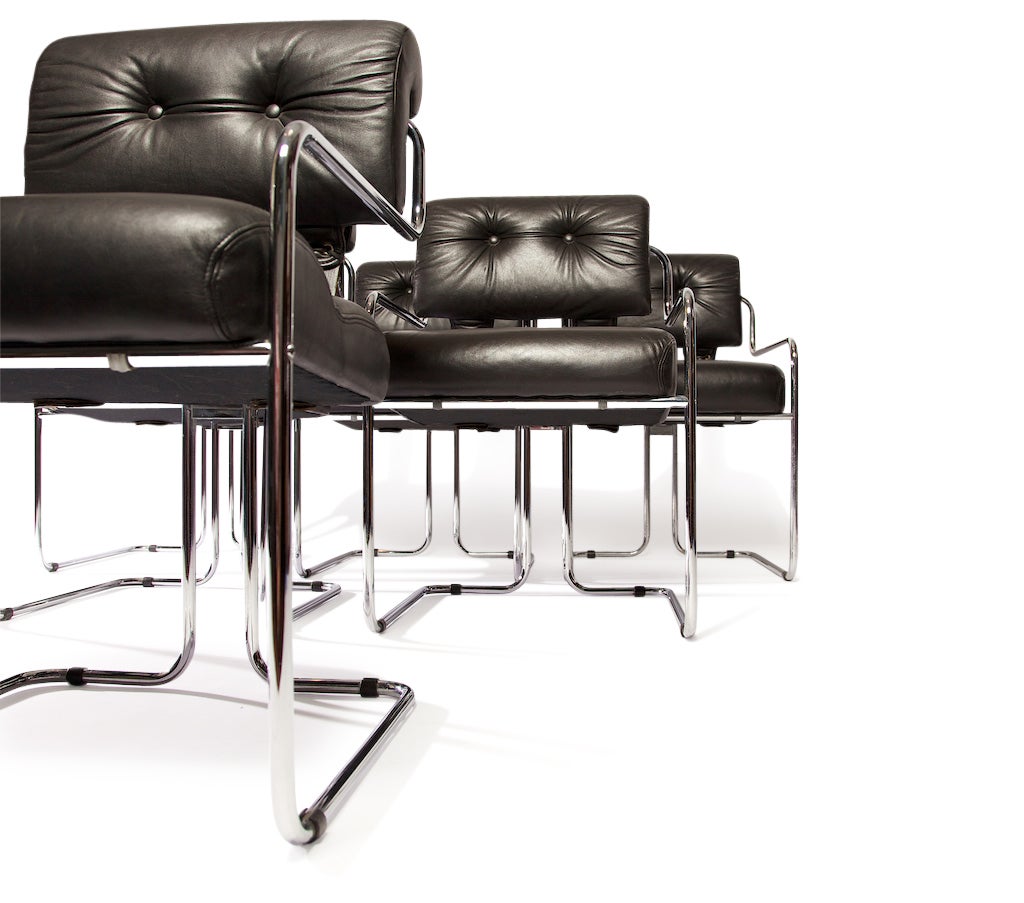 This set of Twelve signed Guido Faleschini Black leather and chrome chairs were designated 