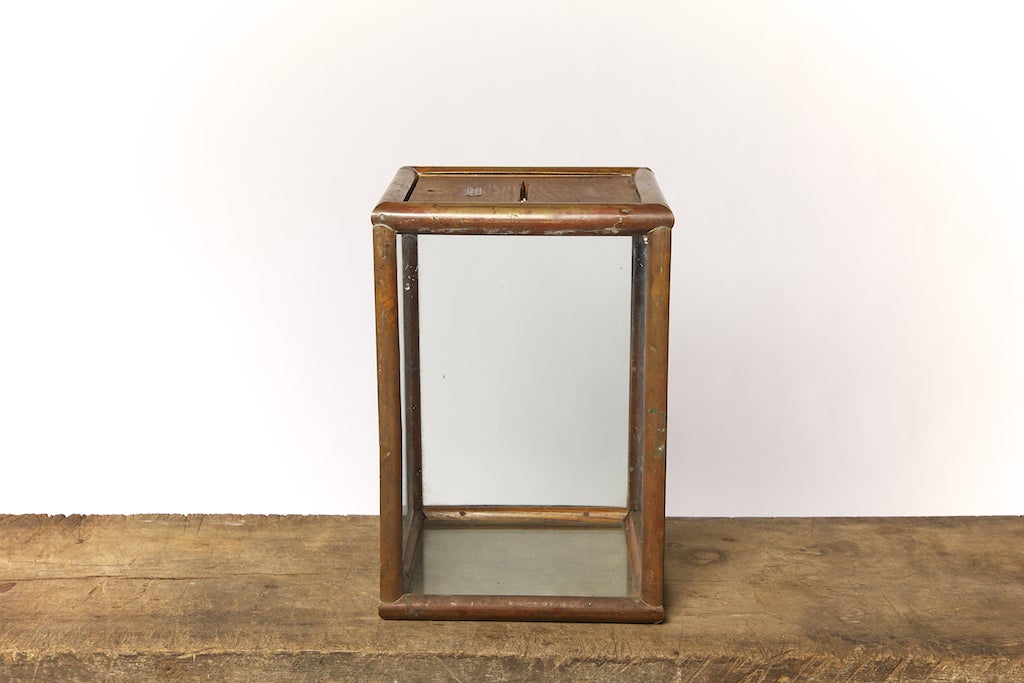Circa 1910, this American ballot box is copper-bound with the original glass panels along with the original oak lid, which lifts up. On the lid is a brass plaque inscribed 'Reinle Salmon Co., Store and Office Fixtures, Baltimore, MD'.

The copper