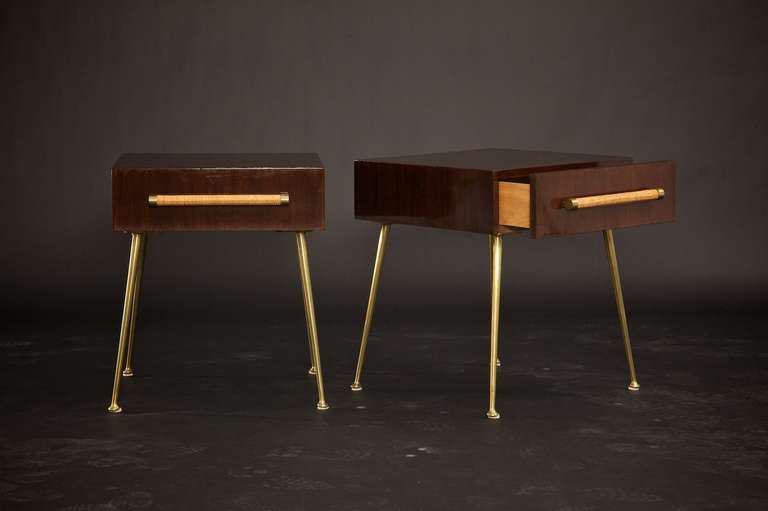 Stunning pair of beautifully lacquered dark walnut Robsjohn side tables, model number 4001, circa 1955.  Everything about these tables are perfect, from the original cane wrapped handles to the warm patina of the brass on both the legs and the