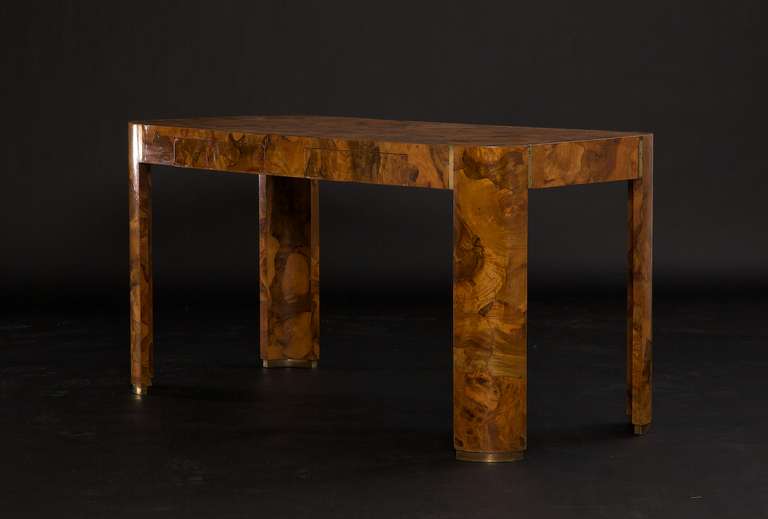 Really spectacular and intricate Italian olive wood desk with beautiful patina brass accents, circa 1970.  The olive wood on this particular piece has aged very nicely like fine wine and has formed a beautiful rich color that will only get better in